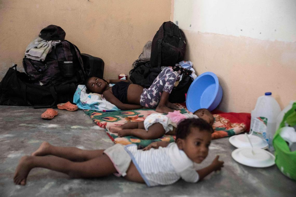 Children rest in a school converted into a shelter after they were forced to leave their homes due to clashes between armed gangs, in the Tabarre neighborhood of Port-au-Prince, Haiti, Thursday, April 28, 2022. (AP Photo/Odelyn Joseph)
