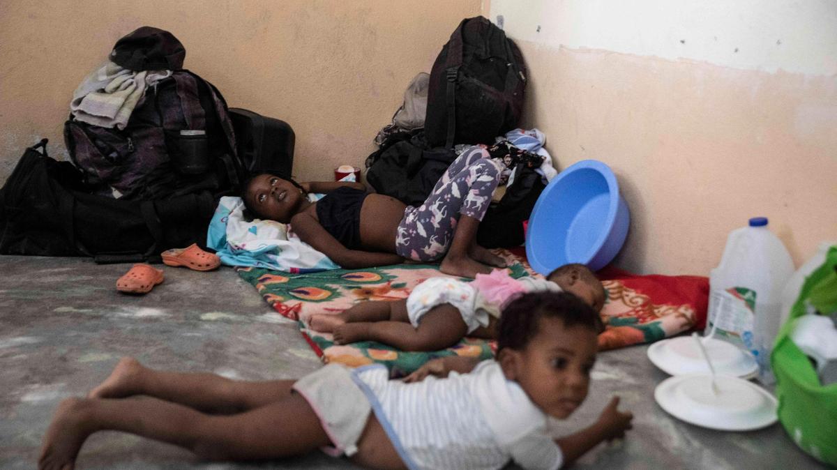 Children rest in a school converted into a shelter after they were forced to leave their homes due to clashes between armed gangs, in the Tabarre neighborhood of Port-au-Prince, Haiti, Thursday, April 28, 2022.