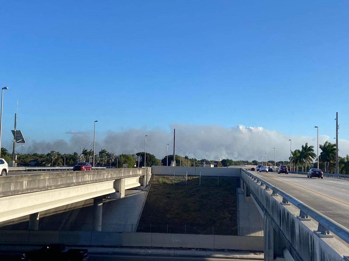 Smoke from brush fires burning along Card Sound Road and the 18 Mile Stretch of U.S. 1 toward the Florida Keys can be seen from Exit 5 of Florida’s Turnpike Tuesday night, March 18, 2025.