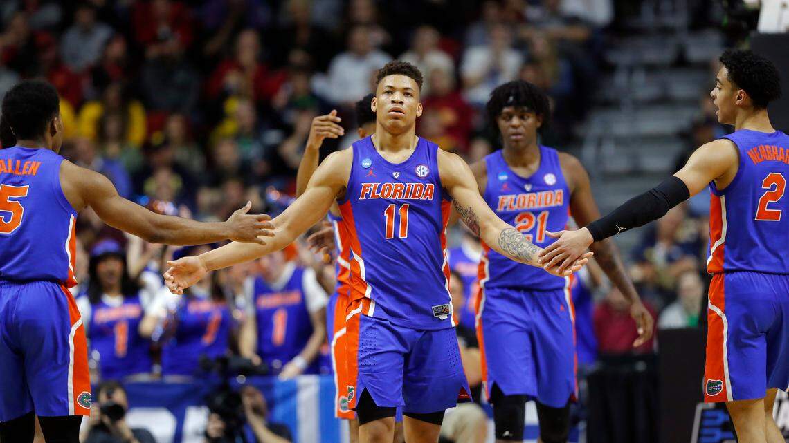 Florida forward Keyontae Johnson (11) celebrates with teammates after making a basket during a first round men’s college basketball game against Nevada in the NCAA Tournament, Thursday, March 21, 2019, in Des Moines, Iowa.