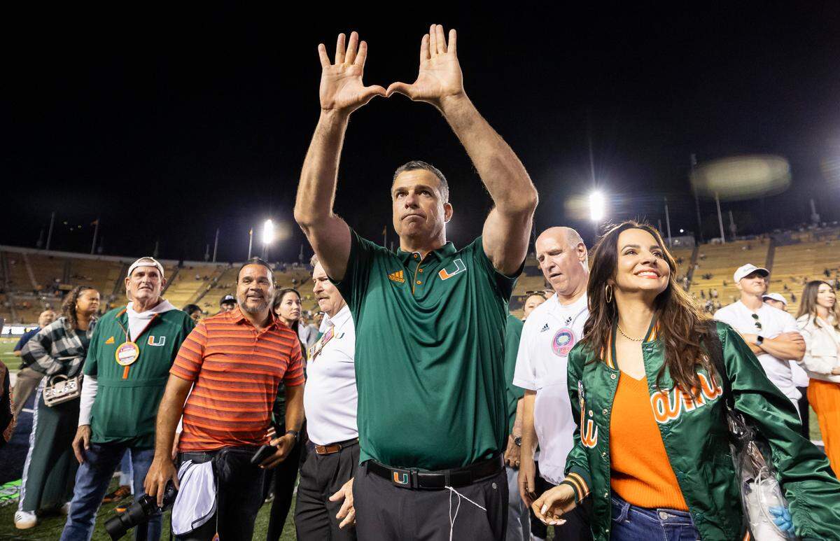 Miami Hurricanes head coach Mario Cristobal throws up the U after his team defeated the California Golden Bears in their NCAA college football game at the California Memorial Stadium on Saturday, Oct. 5, 2024, in Berkeley, Calif.