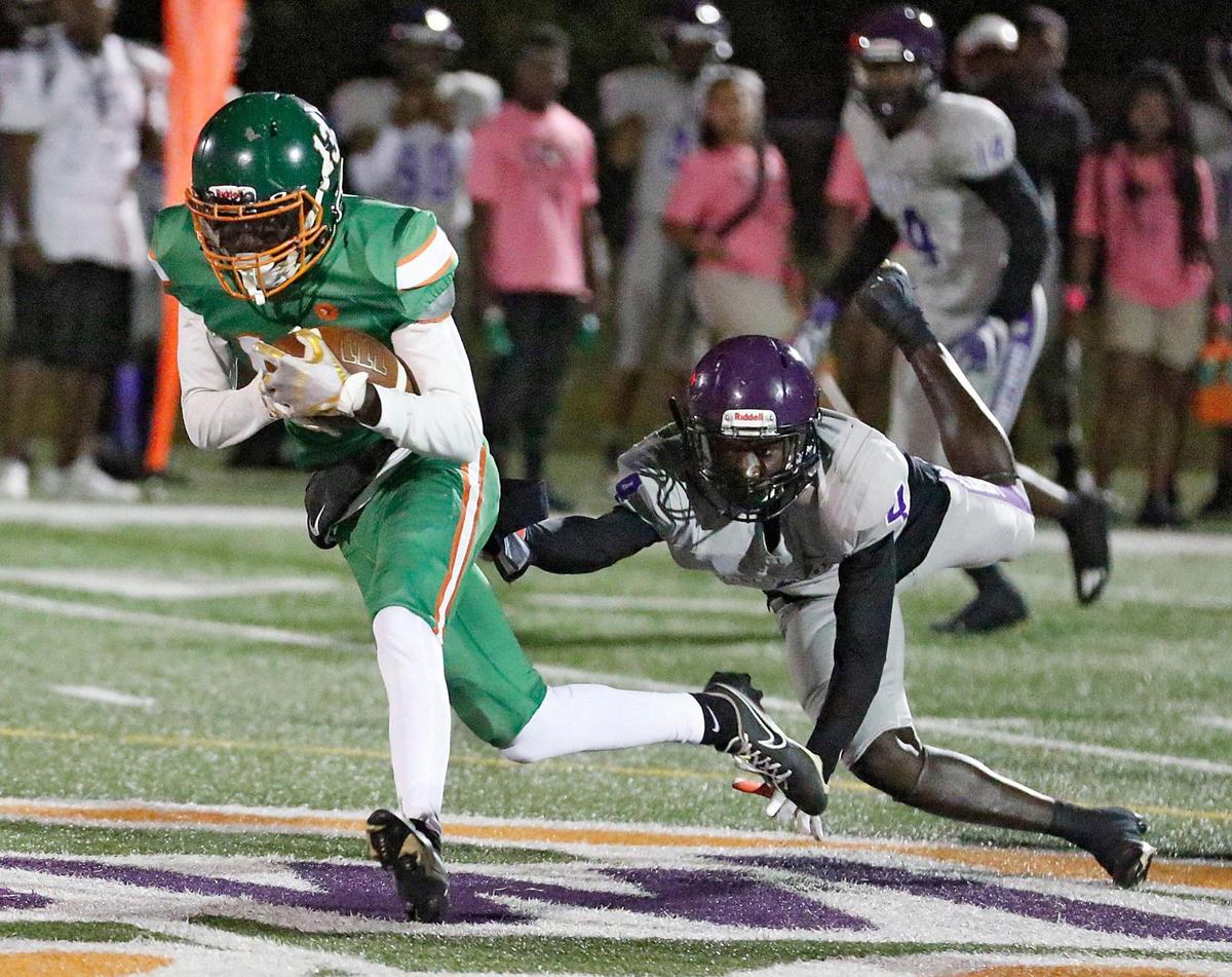 McArthur Mustangs Keymani Fleurme tries to escape Dr. Michael M. Krop Lightning defender during football game on Friday, October 28, 2022 at Ives Estate Park in Miami. Andrew Uloza / for Miami Herald
