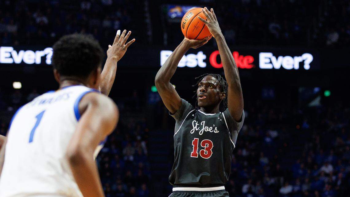 Saint Joseph’s Hawks forward Rasheer Fleming (13) shoots the ball during the first half against the Kentucky Wildcats at Rupp Arena at Central Bank Center.