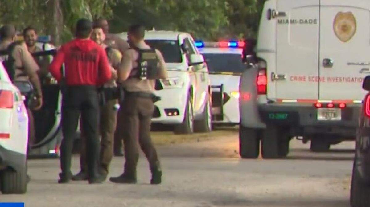 Miami-Dade deputies gather in front of a Redland home where a man was attacked by two large dogs Monday, Feb. 16, 2026. Two deputies shot and killed the dogs when they heard the man screaming, the sheriff’s office said.