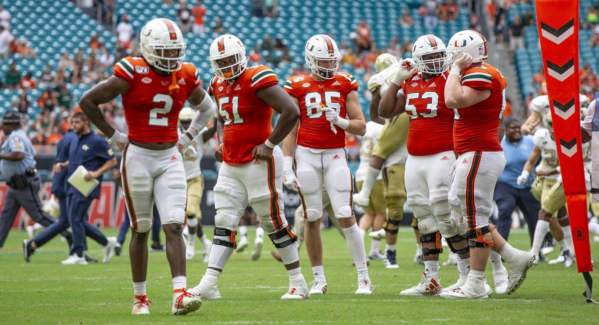 Miami Hurricanes walk off the field as the University of Miami is defeated by Georgia Tech Yellow Jackets 28-21 in overtime at Hard Rock Stadium in Miami Gardens on Saturday, October 19, 2019.