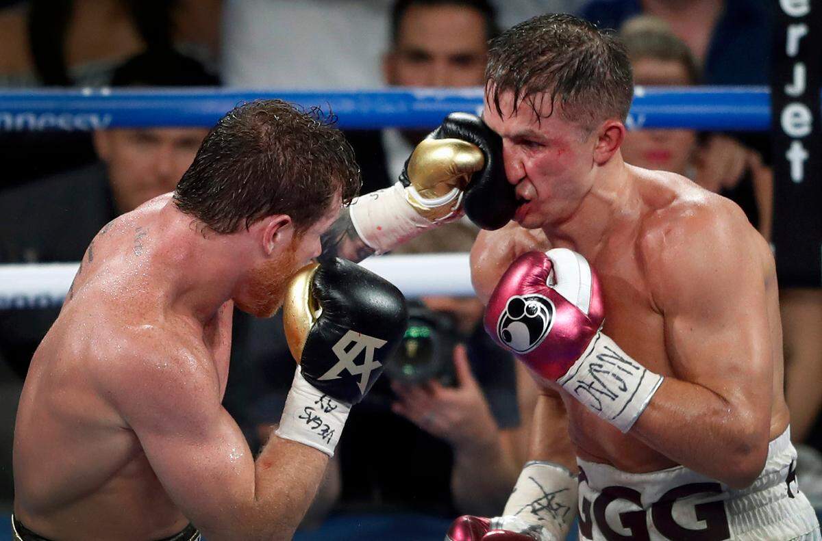 Canelo Alvarez, left, of Mexico, lands a punch on WBC/WBA middleweight champion Gennady Golovkin, of Khazakstan, during their title boxing fight at T-Mobile Arena in Las Vegas, Saturday, Sept. 15, 2018. Alvarez took Glolovkin’s WBC/WBA titles by majority decision. (Steve Marcus/Las Vegas Sun via AP)
