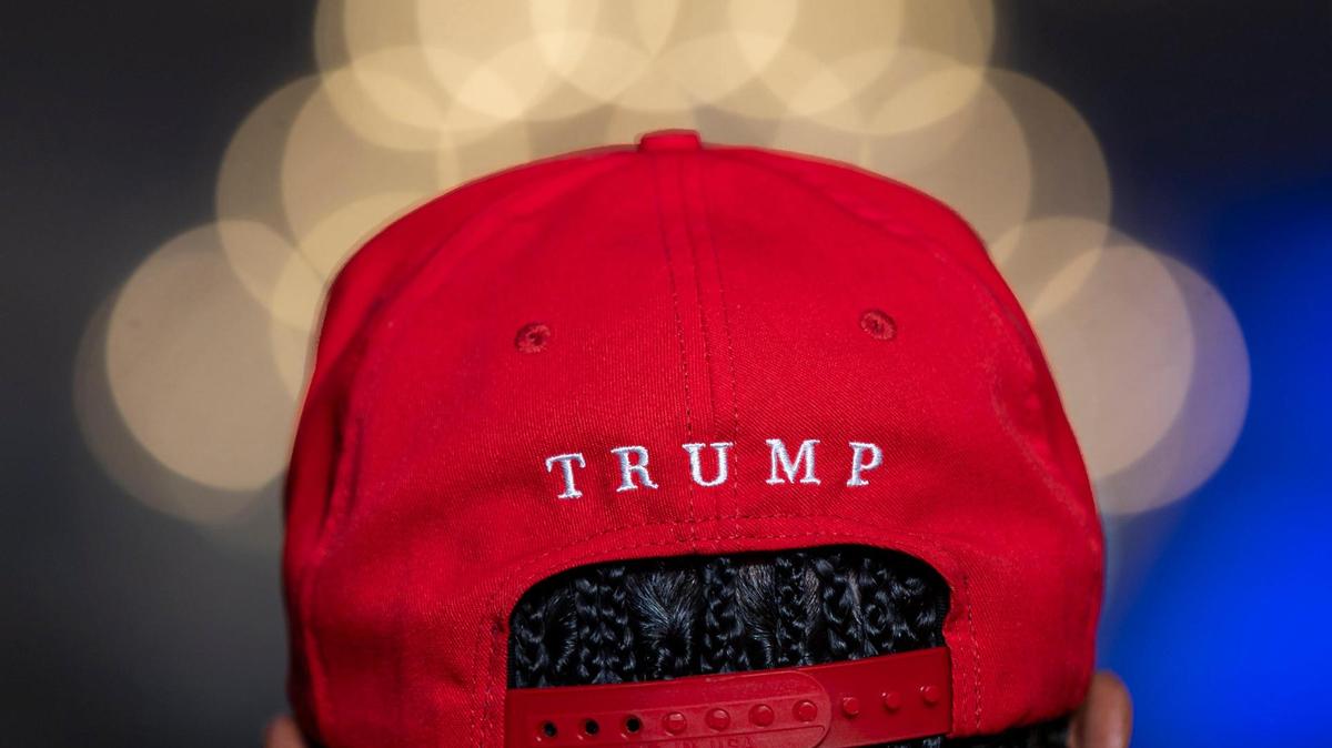 A supporter listens to Republican presidential candidate and former President Donald Trump speak during a roundtable discussion with local Latino leaders at Trump National Doral Miami on Oct. 22.