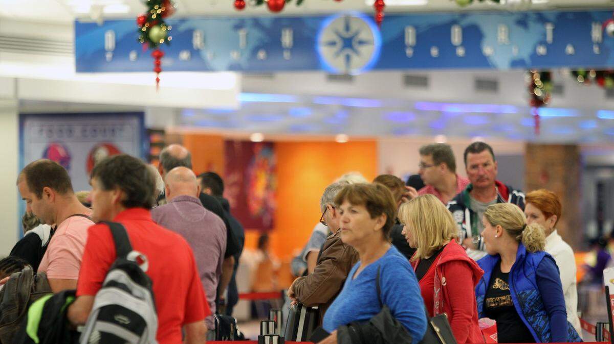 General view of travelers at Concourse D in Miami International Airport who were traveling for the holidays on Nov. 22, 2016.
