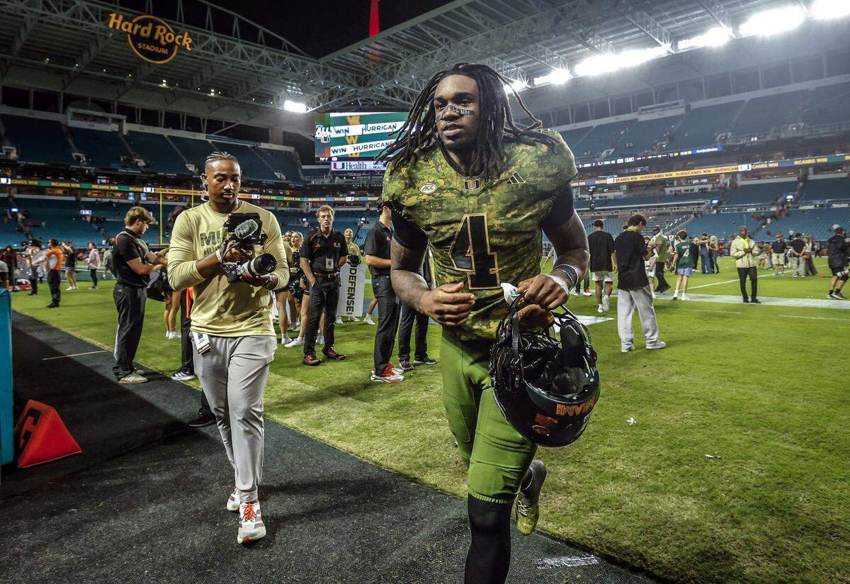 Miami Hurricanes running back Mark Fletcher Jr. (4) runs off the field after the Canes defeat Stanford Cardinal during their NCAA football game at Hard Rock Stadium in Miami Gardens, Florida, on Saturday, October 25, 2025.