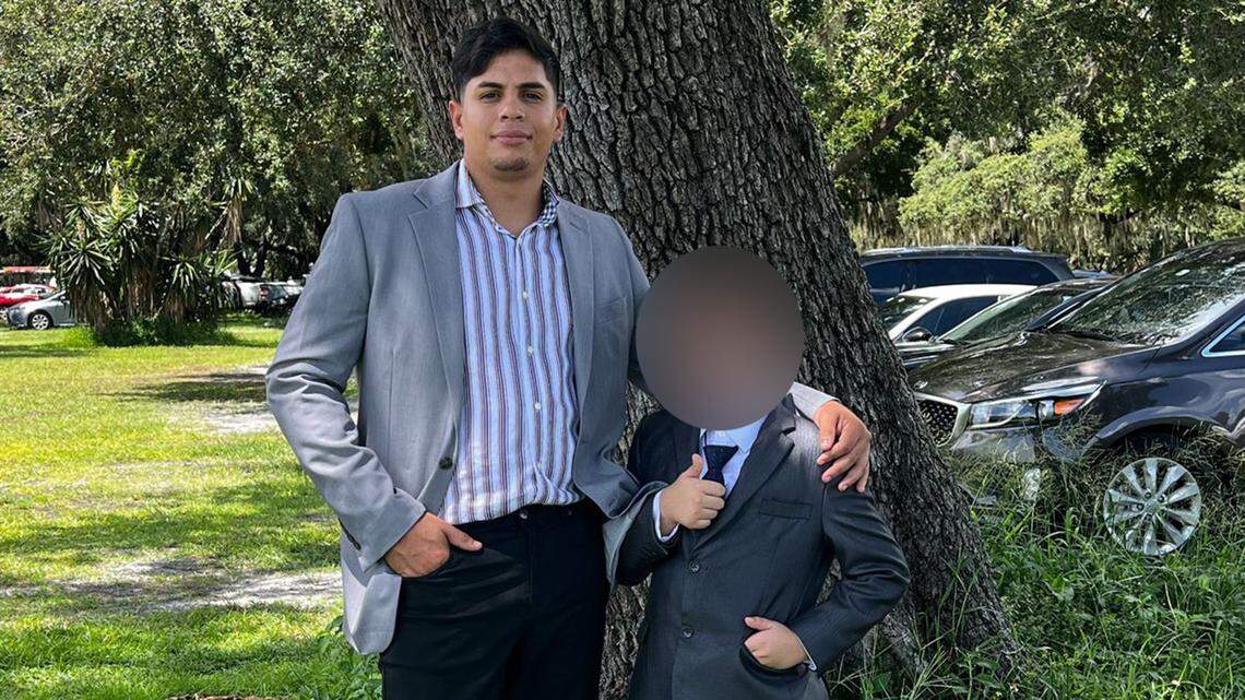 Frengel Reyes Mota and his 9-year-old stepson, whose face has been blurred to protect his identity.