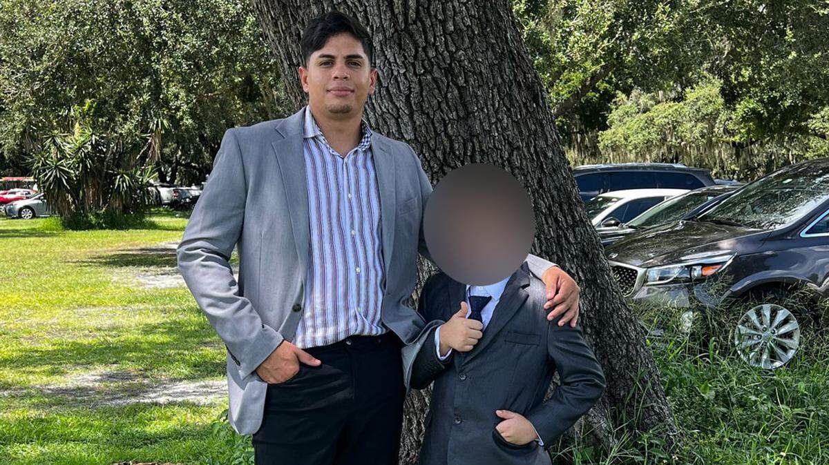Frengel Reyes Mota and his 9-year-old stepson, whose face has been blurred to protect his identity.