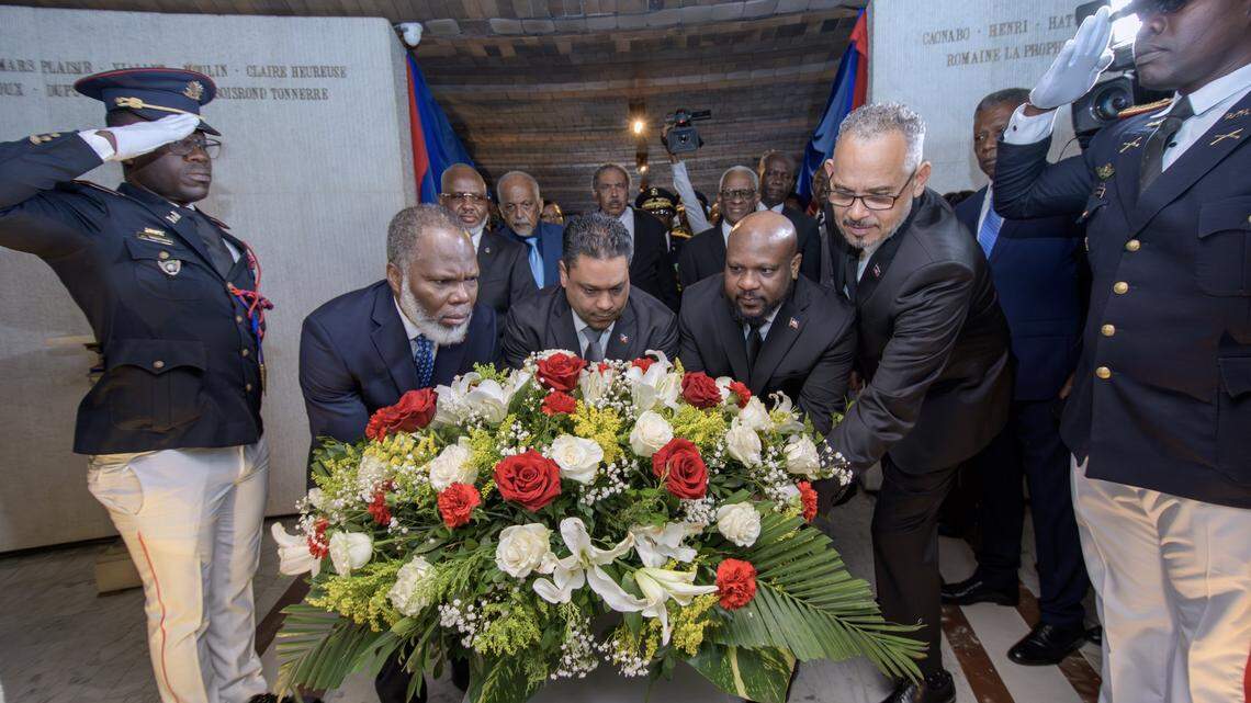 From left to right, Transitional Presidential Council Advisers Frinel Joseph, Laurent Saint-Cyr and Smith Augustin are joined by Prime Minister Alix Didier Fils-Aimé at the MUPANAH on Friday, Jan. 2, 2026 to pay homage to Haiti’s ancestors.