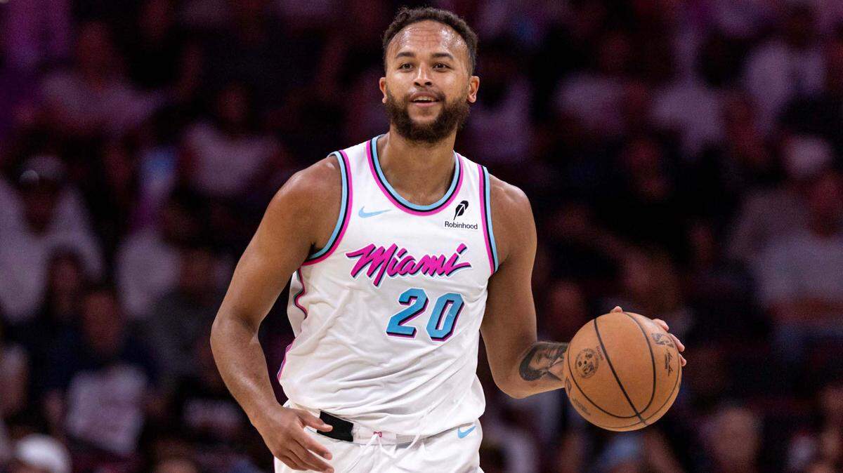 Miami Heat forward Kyle Anderson (20) dribbles down court during the second half of an NBA game against the Philadelphia 76ers at Kaseya Center on April 7, 2025, in Miami.