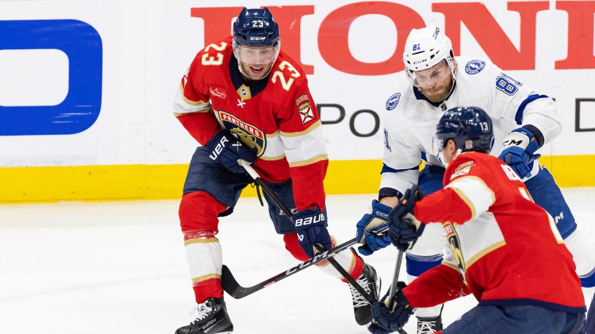 Florida Panthers center Carter Verhaeghe (23) and center Sam Reinhart (13) try to keep the puck from Tampa Bay Lightning defenseman Erik Cernak (81) during second period of Game 5 of first-round series of Stanley Cup playoffs on Monday, April 29, 2024, at Amerant Bank Arena in Sunrise, Fla.