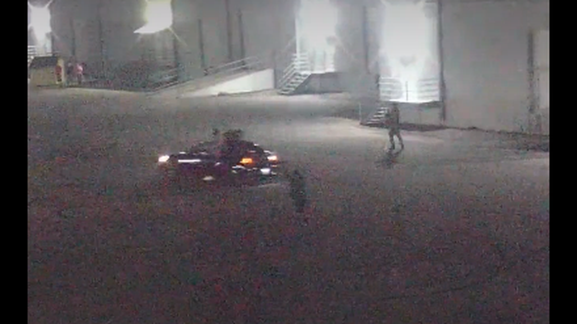 A security camera captured the moment one of the vehicles nearly ran down someone attempting to record the illegal street race, officials said.