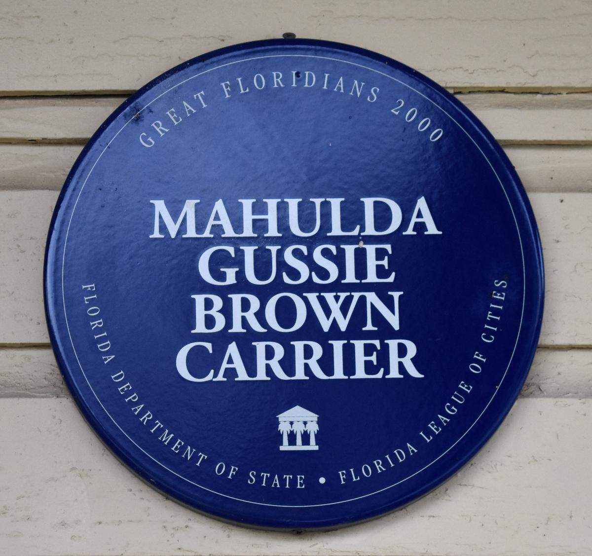 A plaque recognizing Rosewood schoolteacher Mahulda Gussie Brown Carrier stands untouched at the Archer Historical Society Railroad Museum, in Archer, Florida on Thursday, Dec. 22, 2022. (Fresh Take Florida/Lauren Whiddon)