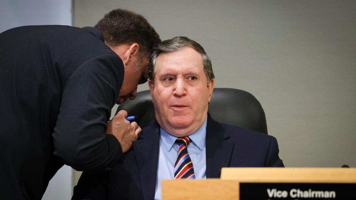 Vice Chairman Joe Carollo speaks to a city employee during a Miami City Commission meeting on Thursday, Nov. 21, 2024, at Miami City Hall in Coconut Grove.