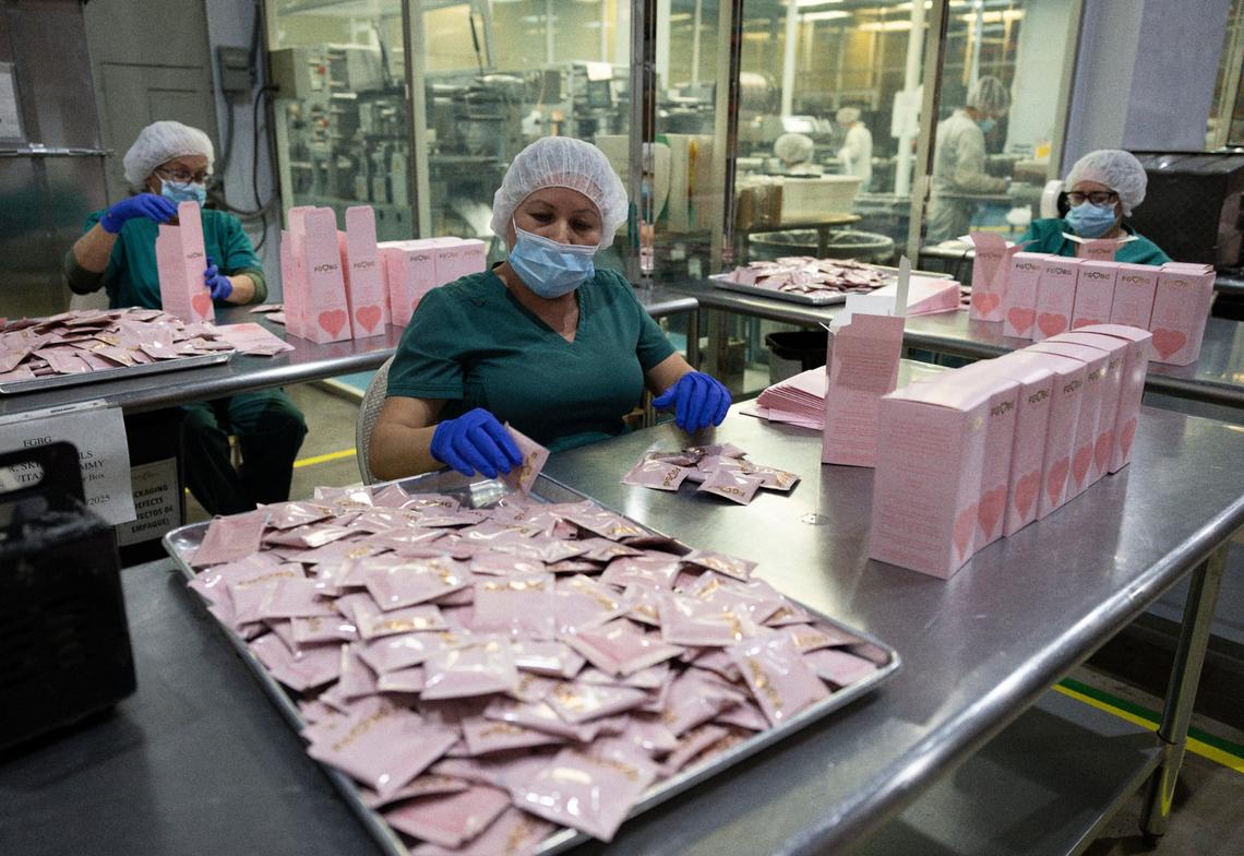 Workers package FGBG Hair, Skin and Nail gummies in the PharmaCenter packing warehouse on Tuesday, March 19, 2024, in Davie, Florida.