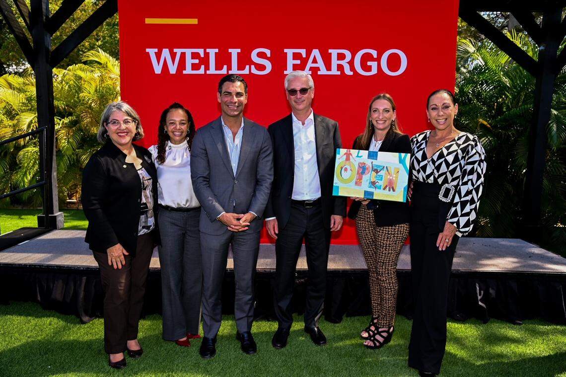 Miami-Dade Mayor Daniella Levine Cava, Miami Commissioner Christine King, Miami Mayor Francis Suarez, Wells Fargo CEO Charlie Scharf, Miami Foundation President and CEO Rebecca Fishman Lipsey, and New Century Dance Company business owner Alexandra Sliva as the Foundation is awarded a record $20 million from the banking giant.