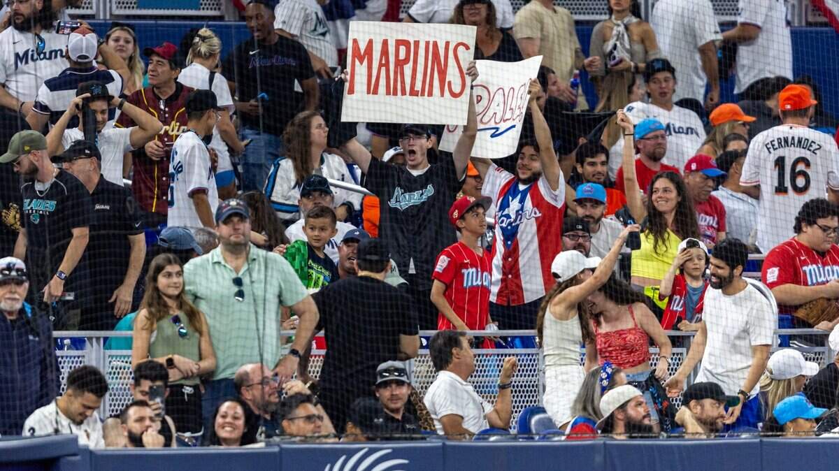 Baseball fans react during an MLB game against the Pittsburgh Pirates in Miami on March 28, 2024.