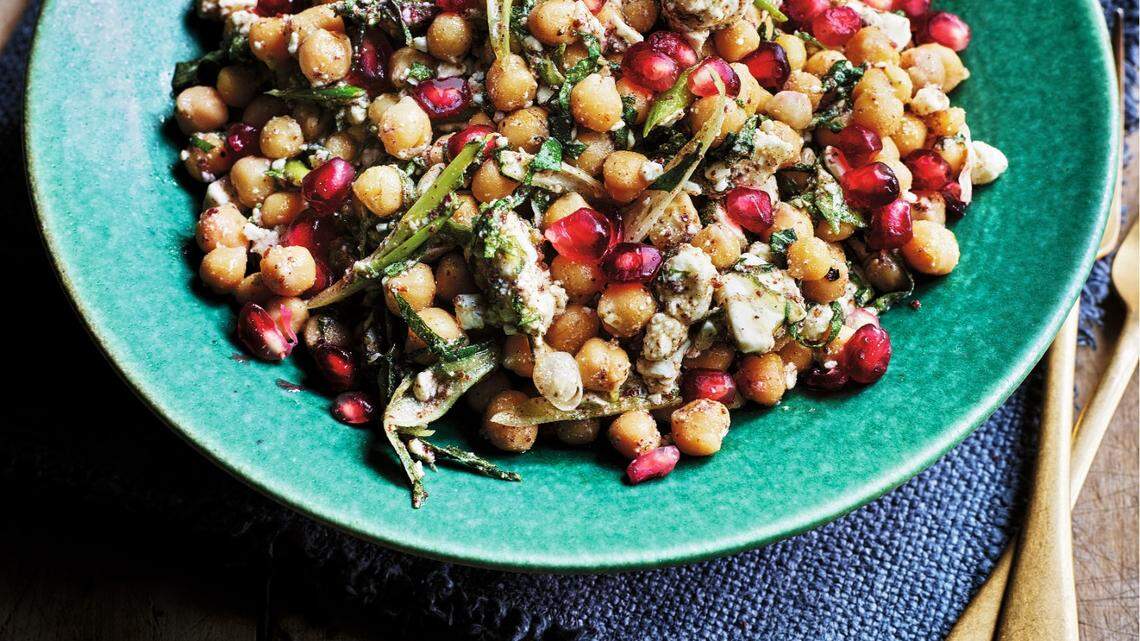 Chickpea salad with feta cheese and pomegranate seeds.