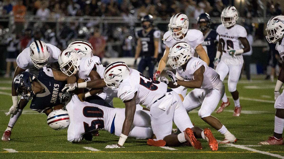 Chaminade-Madonna’s defense takes down University School’s Kenneth McIntosh (1) in the fourth quarter on November 2, 2018.
