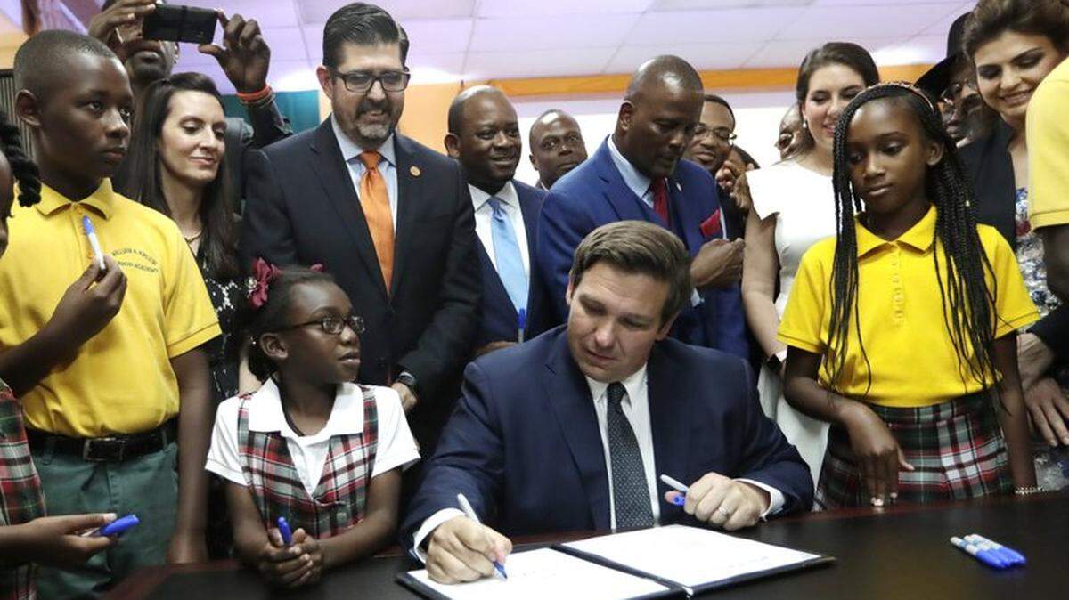 Florida Gov. Ron DeSantis signs into law the $130 million Family Empowerment Scholarship program, which lets low- and middle-income students attend private and religious schools using taxpayer funds.