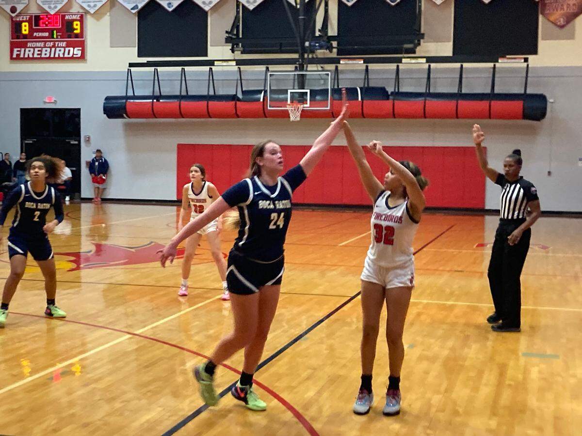 Doral Academy guard Victoria Valle shoots a three-pointer during Thursday night’s Region 4-7A final against Boca Raton at the Doral gym.