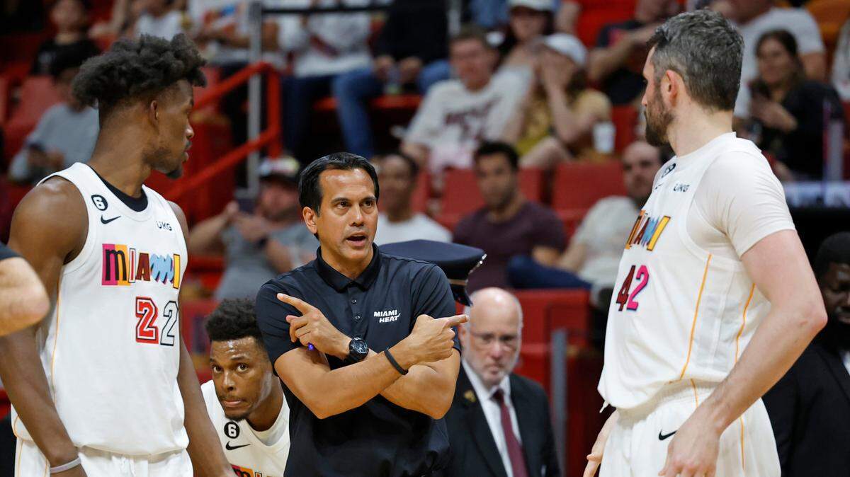 Miami Heat coach Erik Spoelstra directs players Miami Heat forward Jimmy Butler (22) and forward Kevin Love (42) doing the game against the Brooklyn Nets in the second half at Miami-Dade Arena in Miami, Fl. on Saturday, March 25, 2023.