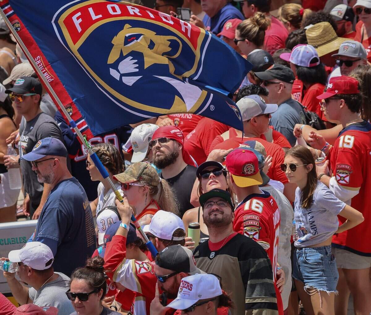 Panthers fan line up on both side of A1A just north of the staging area for the Florida Panthers Stanley Cup championship celebration parade on Sunday, June 22, 2025 in Fort Lauderdale, Florida.
