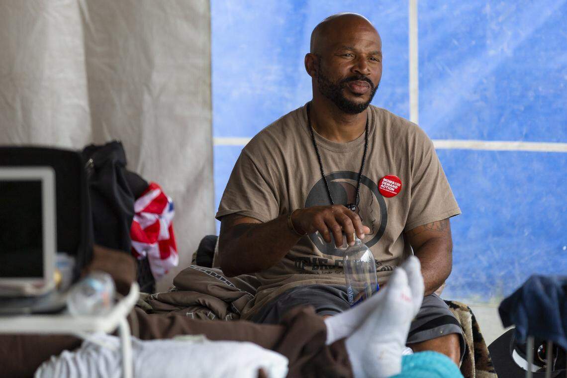 Anthony Blackman, a member of the Circle of Brotherhood, participates in the 10th day of a hunger strike inside a makeshift tent adjacent to Liberty Square in Liberty City on Monday, March 18, 2019. Blackman is one of nine members participating in the hunger strike campaign titled Operation Hunger Strike, which aims to end gun violence and bring increased awareness to the issue.