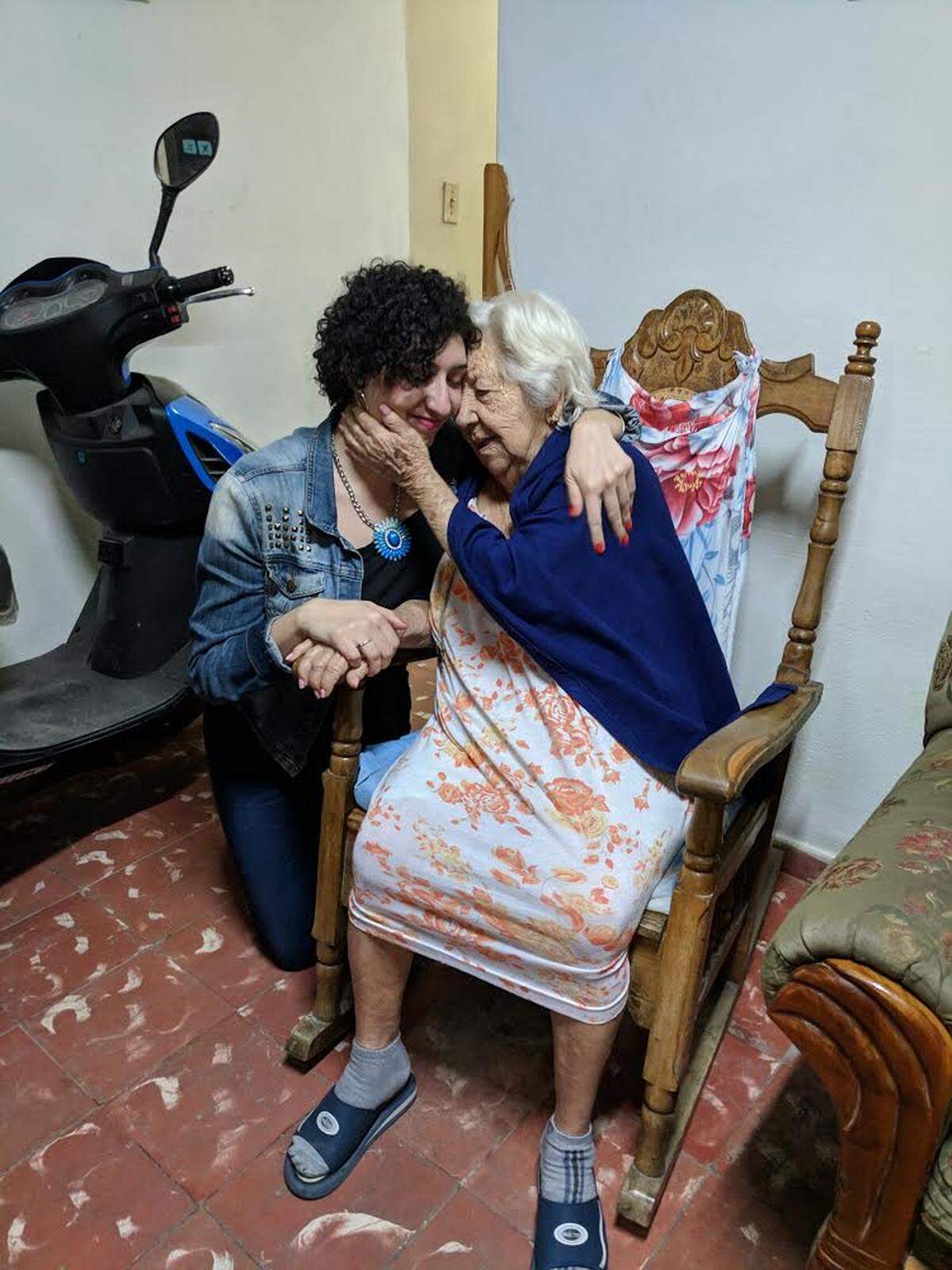 Elizabeth Estrada, left, meets her 97-year-old great aunt Candace for the first time during a trip to Havana. Estrada was so moved by the plight of Cuban tornado victims that she started a fund-raising campaign.