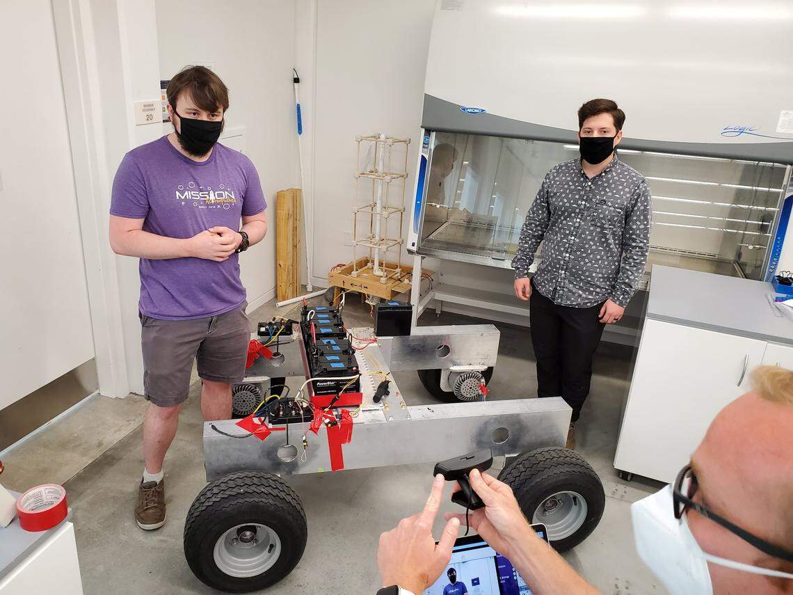 Florida Polytechnic University seniors Reese Epright, left and Gunnar Sundberg work on a planetary rover as a capstone design project.