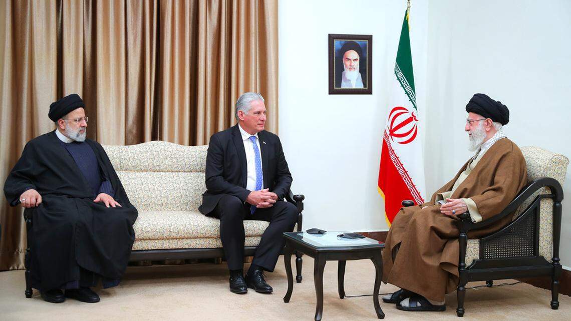On Dec. 4, in Tehran, Iran, Cuban leader Miguel Díaz-Canel, center, meets with Iran’s President Ebrahim Raisi, left, and Supreme Leader Ayatollah Seyyed Ali Hosseini Khamenei.