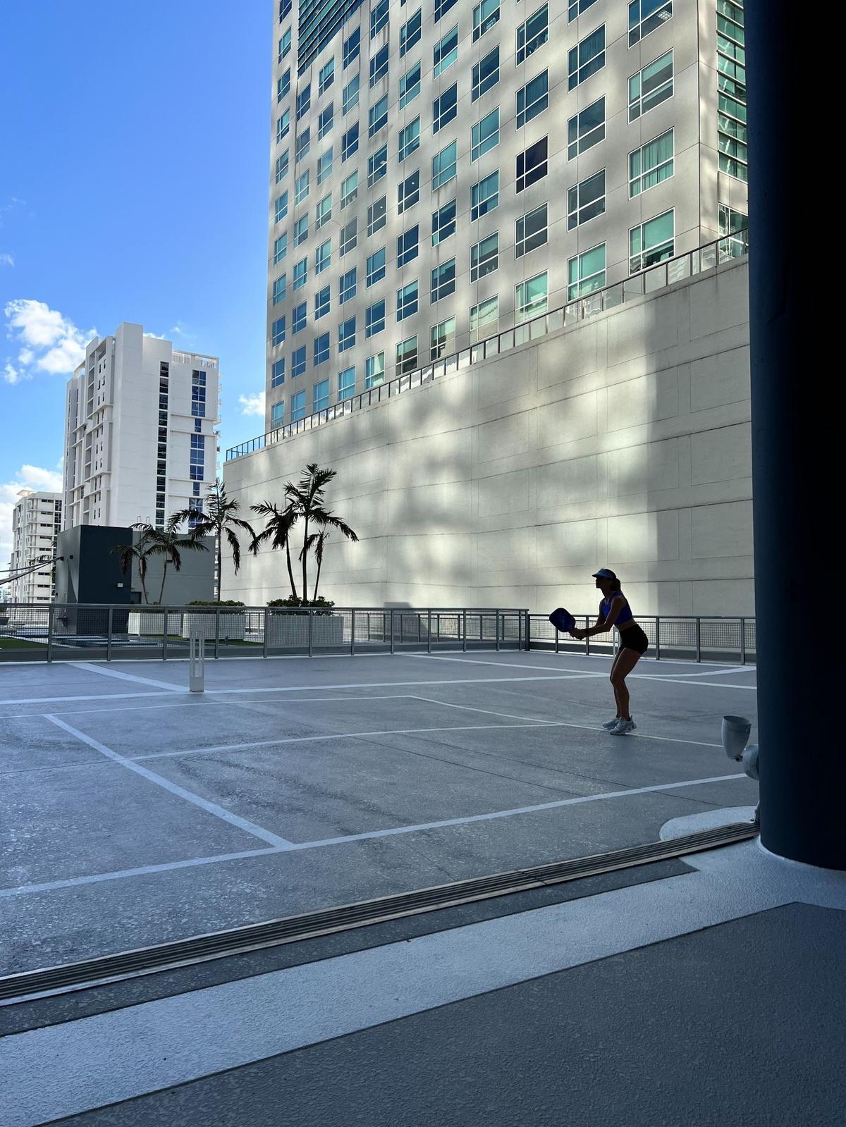 Neo Vertika, a high-rise condominium in Brickell, has a pickleball court at which Miami resident Carolyn Glickstein teaches the sport.