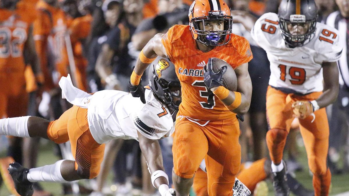 Carol City Chiefs’ Katravis Geter (3) carries the ball against Booker T. Washington on Oct. 18. Carol City is unbeaten heading into Friday’s big matchup against Miami Central.