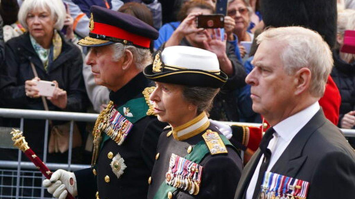 King Charles III, Princess Anne and Prince Andrew join the procession of Queen Elizabeth II’s coffin from the Palace of Holyroodhouse to St Giles’ Cathedral in Edinburgh on Sept. 12.