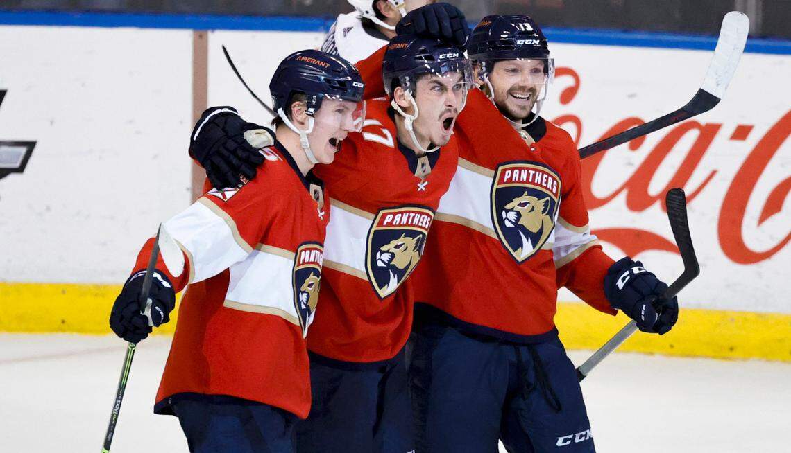 Florida Panthers left wing Mason Marchment (17) celebrate with teammates Anton Lundell (15) and Sam Reinhart (13) after scoring an empty net goal during the third period of an NHL game against the Vegas Golden Knights at the FLA Live Arena on Thursday, January 27, 2022 in Sunrise, Fl.