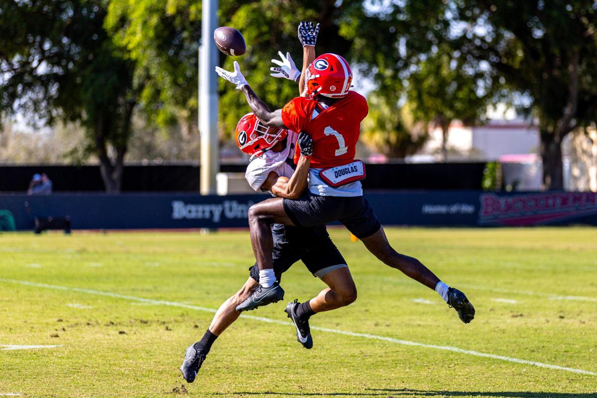 University of Georgia wide receiver Marcus Rosemy-Jacksaint (1) attempts to catch the ball while covered by defensive back Joenel Aguero during Orange Bowl practice at Barry University in Miami Shores, Florida, on Wednesday, December 27, 2023.