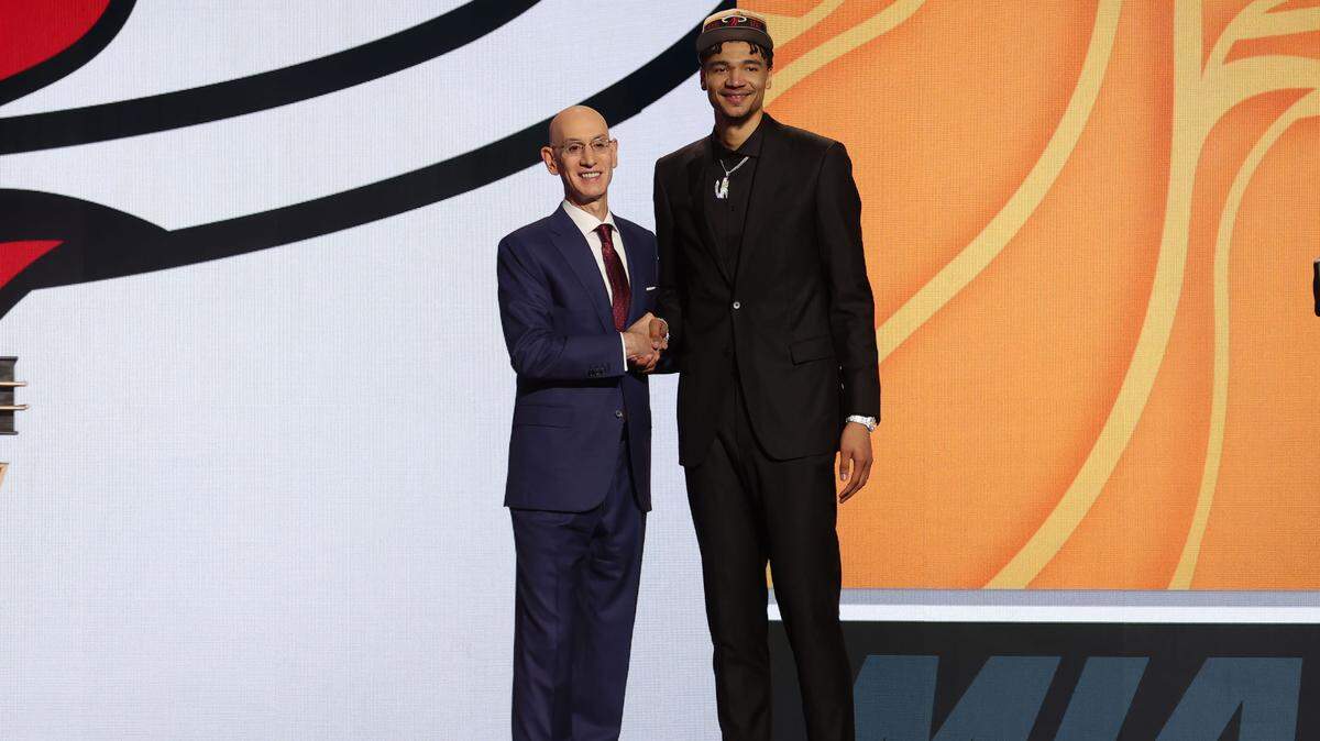 Kel’el Ware poses for photos with NBA commissioner Adam Silver after being selected in the first round by the Miami Heat in the 2024 NBA Draft at Barclays Center.