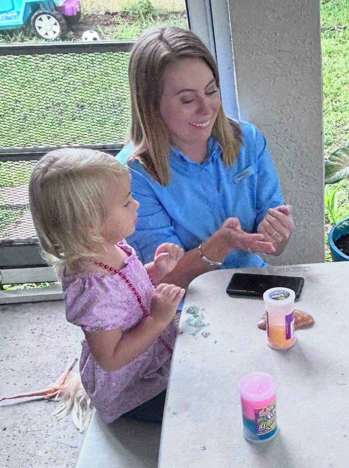 Mary Gingles plays with her daughter Seraphine in an undated photo.