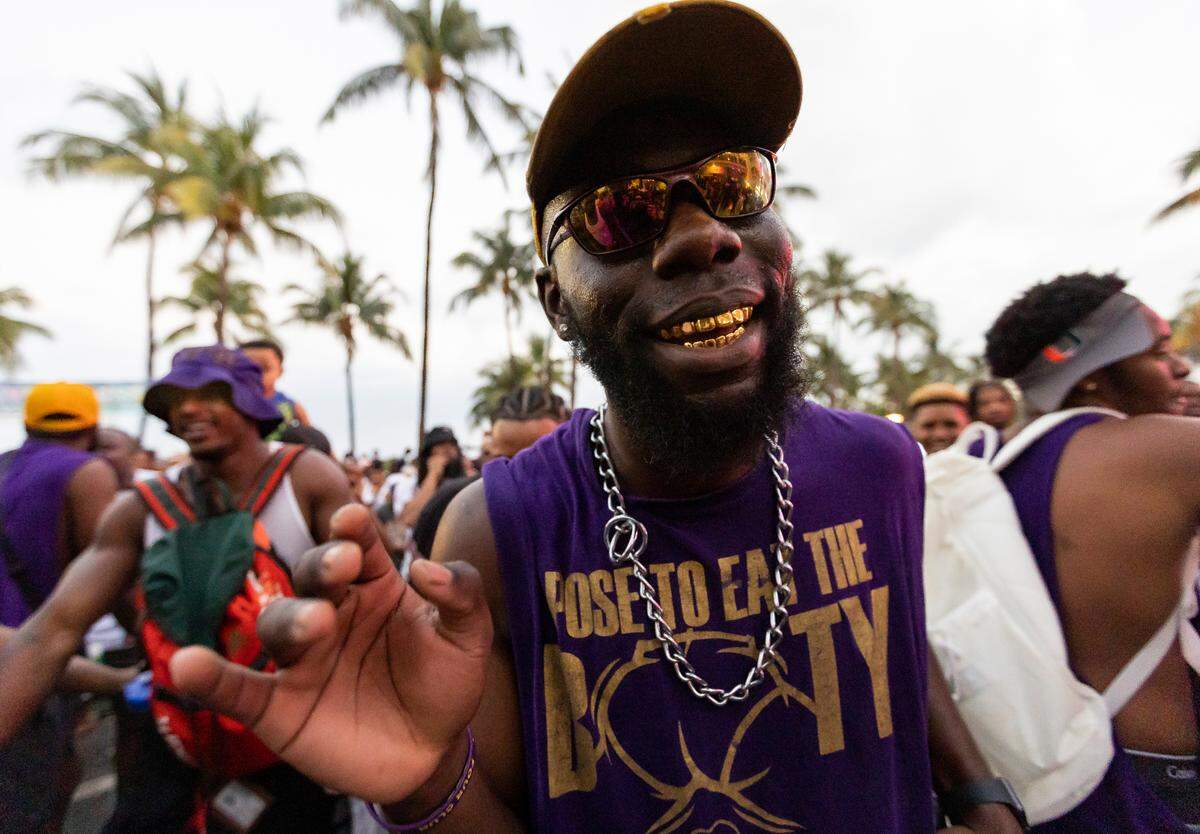 Dayo Akinwole dances with fellow members of Omicron Delta Chapter of Omega Psi Phi on Ocean Drive during spring break on Saturday, March 11, 2023, in Miami Beach, Fla.
