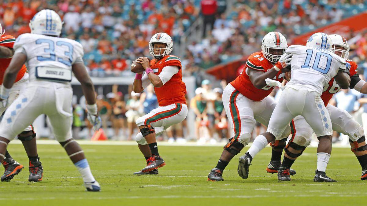 Miami Hurricanes tight end David Njoku (86) picks up yardage on a pass reception as North Carolina Tar Heels cornerback M.J. Stewart (6) makes the stop in the second quarter as the University of Miami Hurricanes host the University of North Carolina Tar Heels at Hard Rock Stadium on Saturday, Oct. 15, 2016.