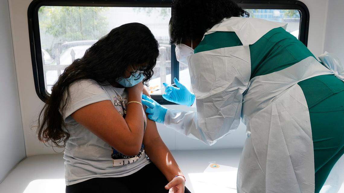 Federal health officials expanded Pfizer COVID-19 booster shot eligibility for 16- and 17-year-olds as the delta and now omicron coronavirus variants spread in the U.S.