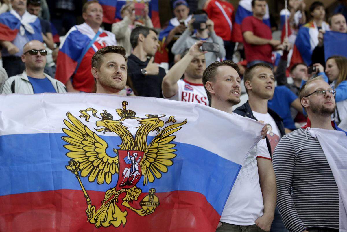 Russian fans with national flags at a 2016 UEFA European Championship Group Stage football match between Russia and Slovakia at Stade Pierre Mauroy in Lille, France.
