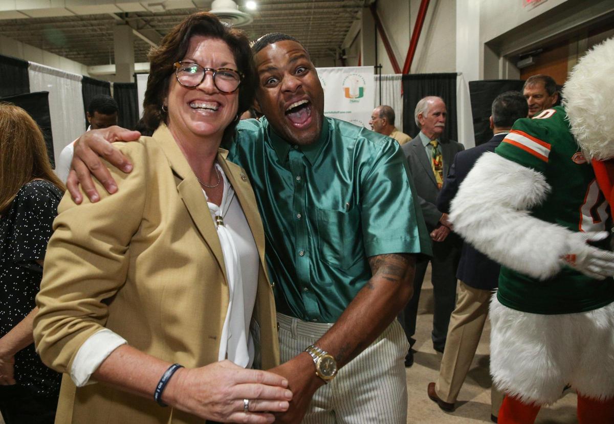 Basketball inductee Jack McClinton celebrates with women’s basketball coach Katie Meier during the University of Miami Sports Hall of Fame Induction Banquet at the Doubletree by Hilton Miami Airport ConventionCenter in Miami, Florida on Thursday, April 21, 2022.