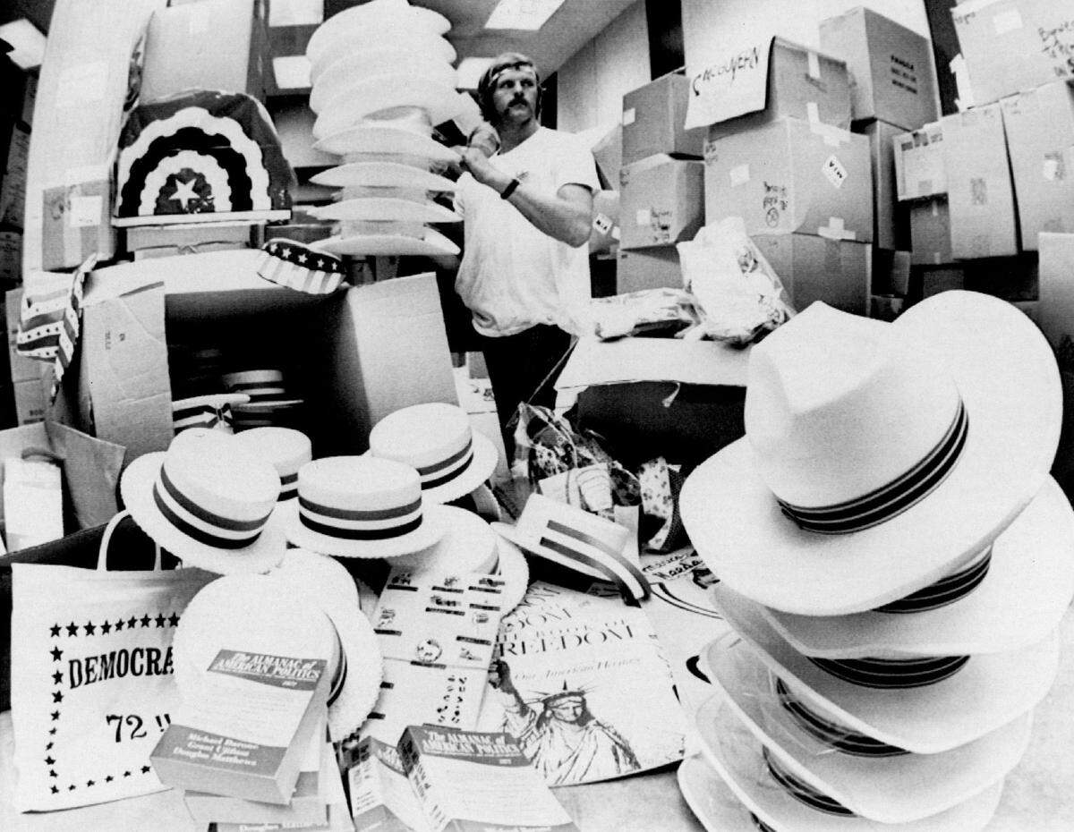 Ray Smith of Chattanooga, Tenn. puts together hats, flags, banners and other convention material for one of the state delegations at the Democratic National Convention in 1972.