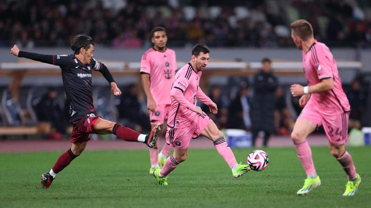 Feb 7, 2024; Tokyo, Japan; Inter Miami CF forward Lionel Messi (10) dribbles against Vissel Kobe midfielder Hotaru Yamaguchi (96) during the second half of a preseason friendly at Japan National Stadium. Mandatory Credit: Naoki Nishimura-USA TODAY Sports