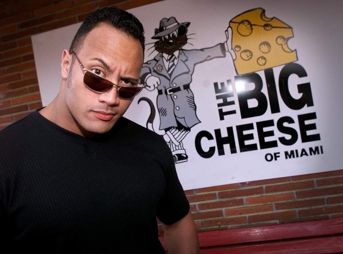 In this file photo from Jan. 28, 2000, Dwayne “The Rock” Johnson hangs out at The Big Cheese in Coral Gables. The University of Miami grad is one of professional wrestling’s biggest stars who went on to a popular movie career.