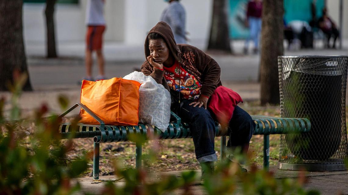 A homeless woman near Government Center in downtown Miami in January. Miami and the Homeless Trust had offered a place to stay ahead of a chilly weekend.
